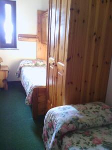 Postel nebo postele na pokoji v ubytování Hotel Savoia Debili