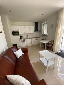 a living room with a couch and a table at Charivy’s Guesthouse in Koudekerke