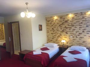 Posteľ alebo postele v izbe v ubytovaní Hotel Sekwana