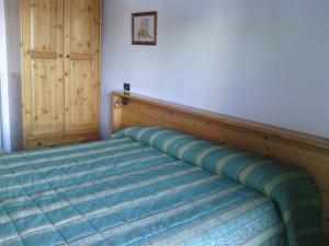 Postel nebo postele na pokoji v ubytování Hotel Savoia Debili