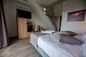 Postel nebo postele na pokoji v ubytování Calda Resort