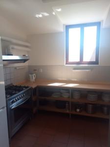 Kuchyň nebo kuchyňský kout v ubytování JEKA - Parma