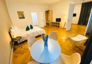a room with a bed and a table and chairs at Crops City Stay in Trieste