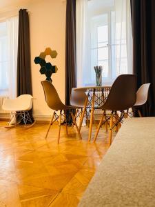 a dining room with a table and chairs at Crops City Stay in Trieste