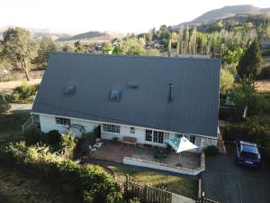 an aerial view of a house with a roof at Honeysuckle Clarens in Clarens