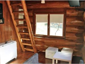 a wooden cabin with a staircase and a window at DiverLanhoso - Alojamento in Póvoa de Lanhoso