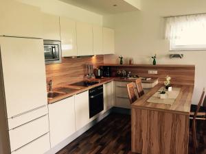 Kuchyň nebo kuchyňský kout v ubytování Das Ferienhaus