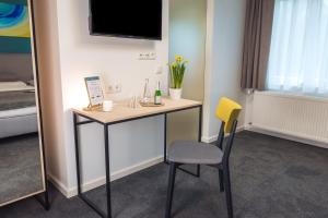 Postel nebo postele na pokoji v ubytování Hotel & Restaurant Mühlenglück