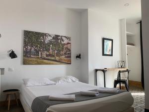 Postel nebo postele na pokoji v ubytování Hotel Le Centre
