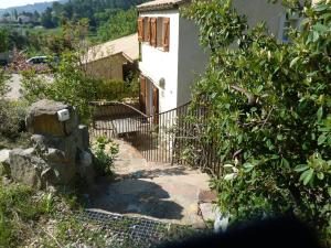 a house with a staircase leading up to a building at La Thorie Ma maison de vacances in Clermont-lʼHérault +7 photos