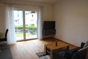 Televízia a/alebo spoločenská miestnosť v ubytovaní Apartment DreamView