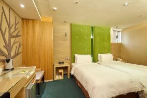 Postel nebo postele na pokoji v ubytování Hotel G7 Taipei