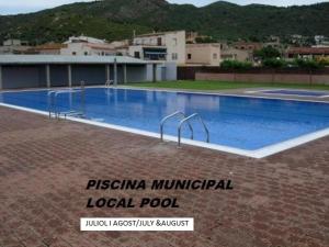 a large swimming pool on top of a building at Ca la Sònia in Pau