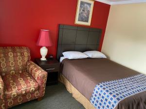 Postel nebo postele na pokoji v ubytování All Seasons Motel