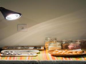 a table with a counter top with food on it at Hotel Rede 1 in Campos dos Goytacazes +16 photos