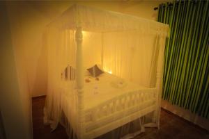 Postel nebo postele na pokoji v ubytování Kanada House Unawatuna