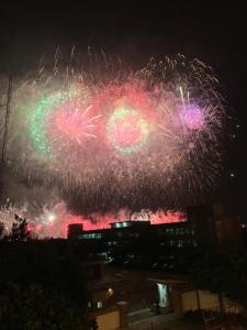 a firework display in the sky at night at 復國8號旅居Bel Panorama Guesthouse in Magong