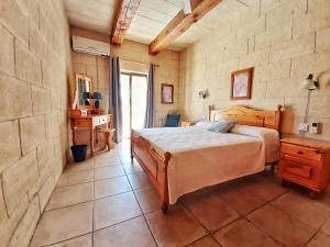 Posteľ alebo postele v izbe v ubytovaní Blossom Farmhouses