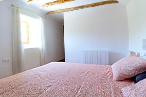 A bed or beds in a room at Casa del Arrabal