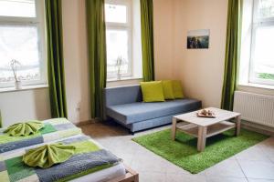 a living room with two beds and a couch at Haus Wettin in Bad Schandau