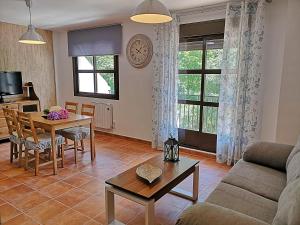 a living room with a couch and a table at Salvatierra in Cazorla