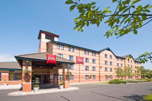 a hotel with a bbg sign on the front of a building at ibis Preston North in Preston