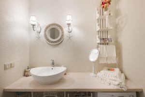 a bathroom with a white sink and a mirror at Vintage Lounge studio by the sea in Liepaja in Liepāja +14 photos