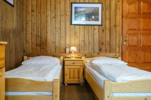 Posteľ alebo postele v izbe v ubytovaní Apartament 3a