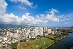 an aerial view of a city with a river and buildings at Waikiki Penthouse @ The Monarch Hotel in Honolulu