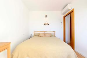 Łóżko lub łóżka w pokoju w obiekcie Can Lou-Casa con Caracter en Cullera