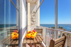 two baskets of fruit sitting on a balcony at Sea View Fairy Tale in Faro