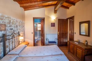 Postel nebo postele na pokoji v ubytování Casa Rural El Molino