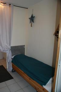 Ένα ή περισσότερα κρεβάτια σε δωμάτιο στο Les Charmilles