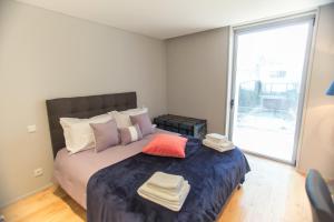 Postel nebo postele na pokoji v ubytování Premium Style Apt by Porto City Hosts