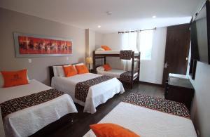 Voodi või voodid majutusasutuse Hotel Ucla Center toas