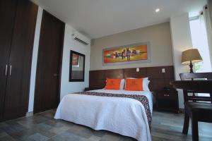 Voodi või voodid majutusasutuse Hotel Ucla Center toas