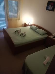 Postel nebo postele na pokoji v ubytování Apartment Nela