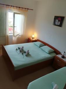 Postel nebo postele na pokoji v ubytování Apartment Nela