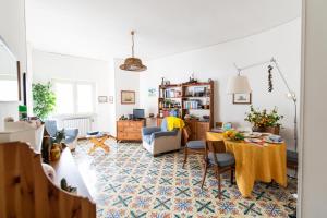 a living room with a table and chairs at Virginia's Guest House in Sorrento