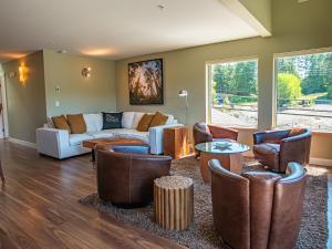 a living room with a couch and chairs at The Moorage in Ucluelet