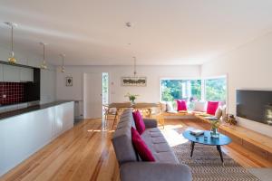 a living room with a couch and a table at Encosta do Sobreiro - Serra da Estrela in Fornos de Algodres
