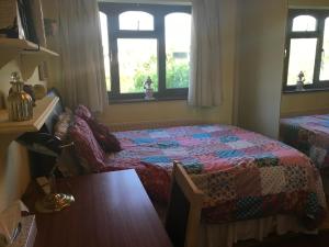 a bedroom with a bed and a desk at The Cedars House B&B in Nuneaton