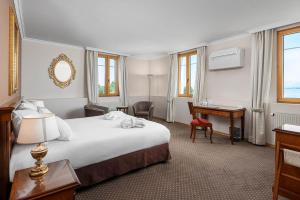 Letto o letti in una camera di Hotel Le Rive