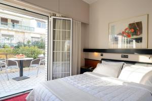 Posteľ alebo postele v izbe v ubytovaní Victory Inn Hotel