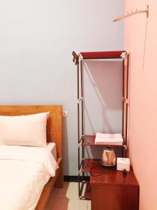 Ein Bett oder Betten in einem Zimmer der Unterkunft RoomZ Budget Residence