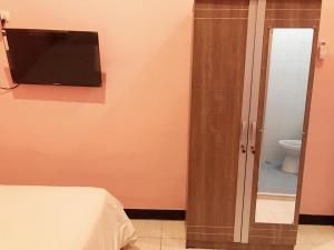Ein Bett oder Betten in einem Zimmer der Unterkunft RoomZ Budget Residence