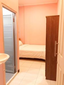 Ein Bett oder Betten in einem Zimmer der Unterkunft RoomZ Budget Residence