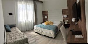 Cama ou camas em um quarto em Hotel Belvedere