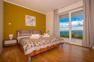 Postel nebo postele na pokoji v ubytování Apartmani Jasminka