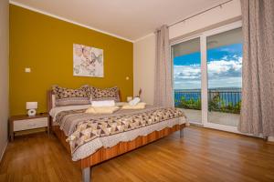 Postel nebo postele na pokoji v ubytování Apartmani Jasminka